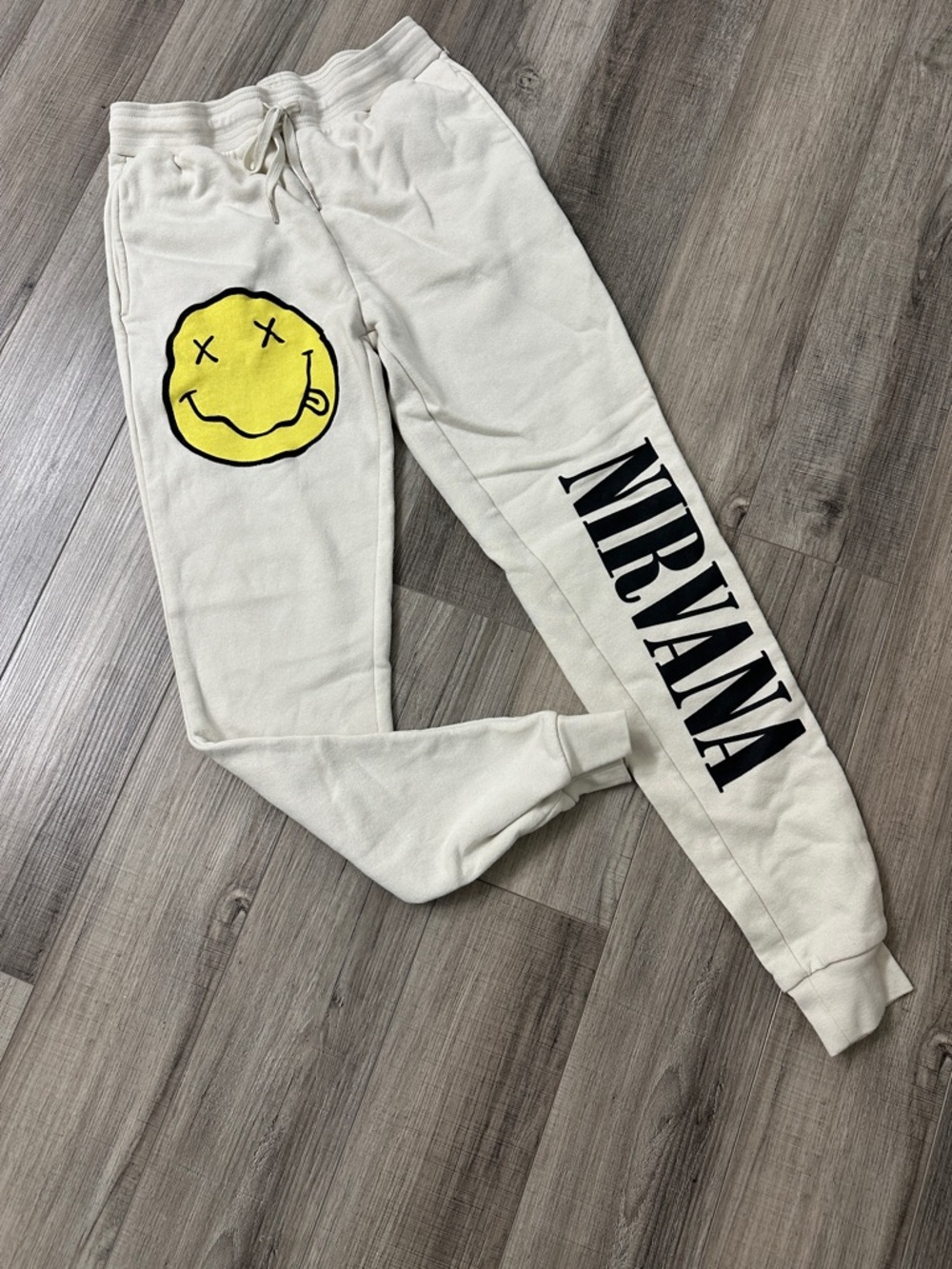 NIRVANA Cream Sweatpants with Black Logo & Yellow Smiley